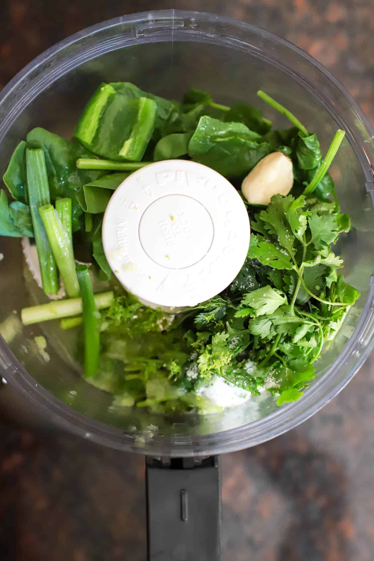 Ingredients for green rice paste in a food processor.