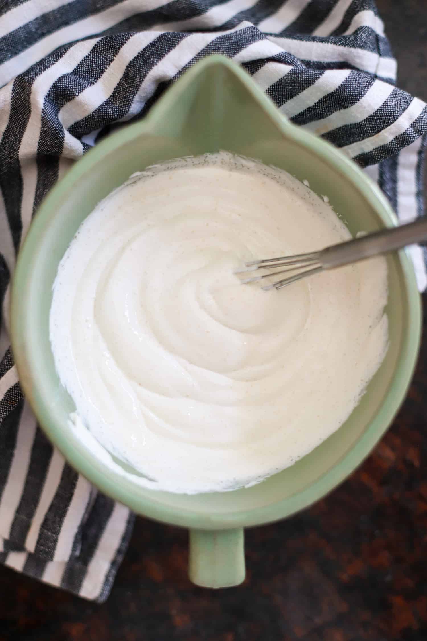Sour cream topping in a small mixing bowl.