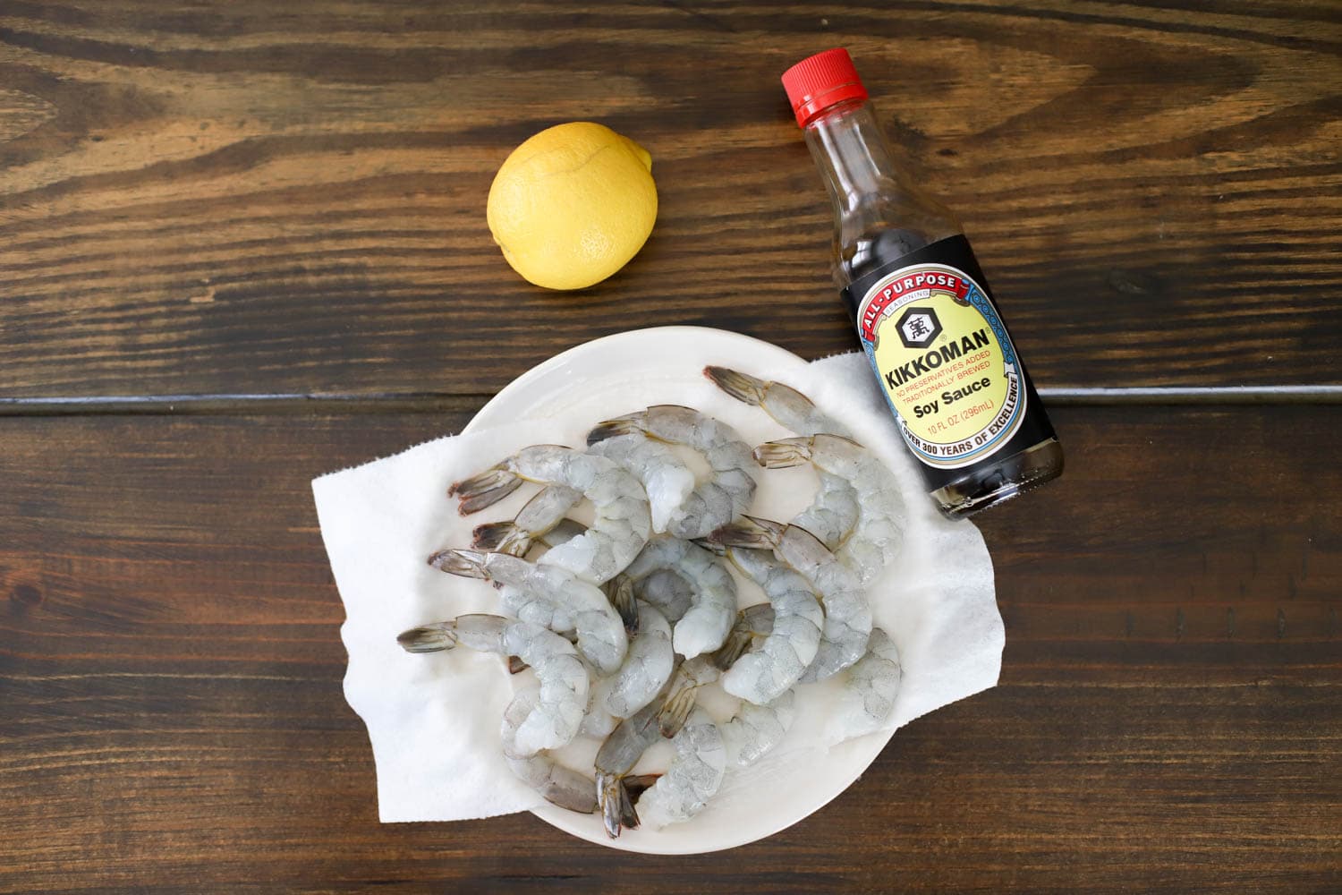 ingredients for hibachi shrimp on brown wood table.