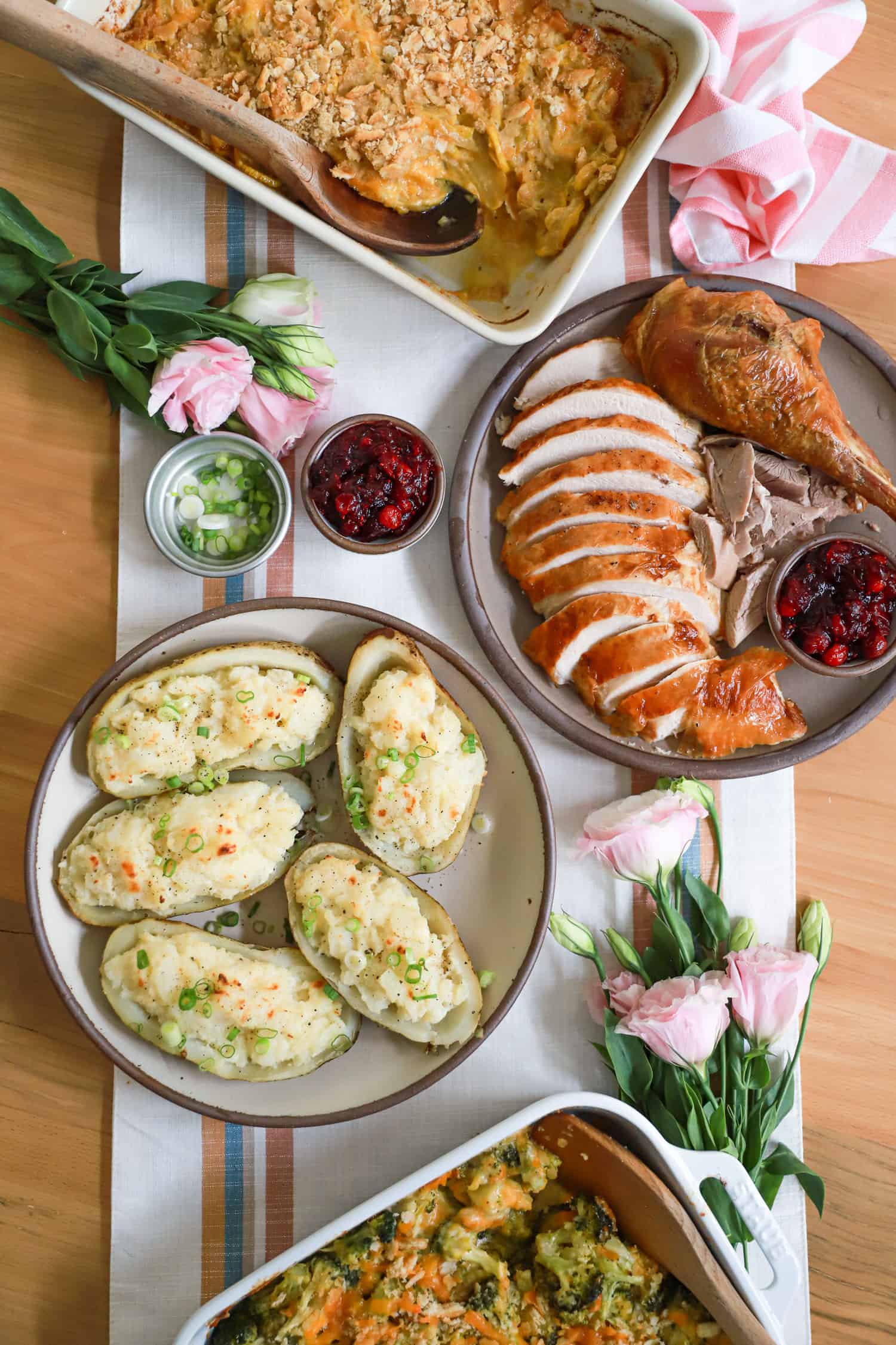 Thanksgiving table featuring turkey and twice baked potatoes.