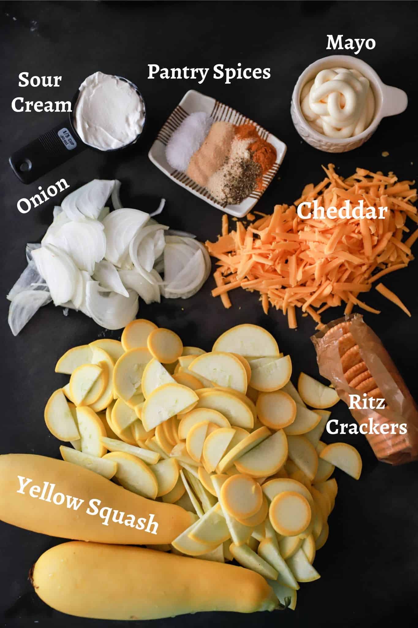 Ingredients for sour cream squash casserole labeled on black board.