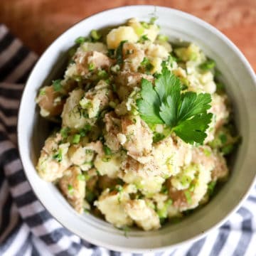 bowl of potato salad with no mayo and herbs
