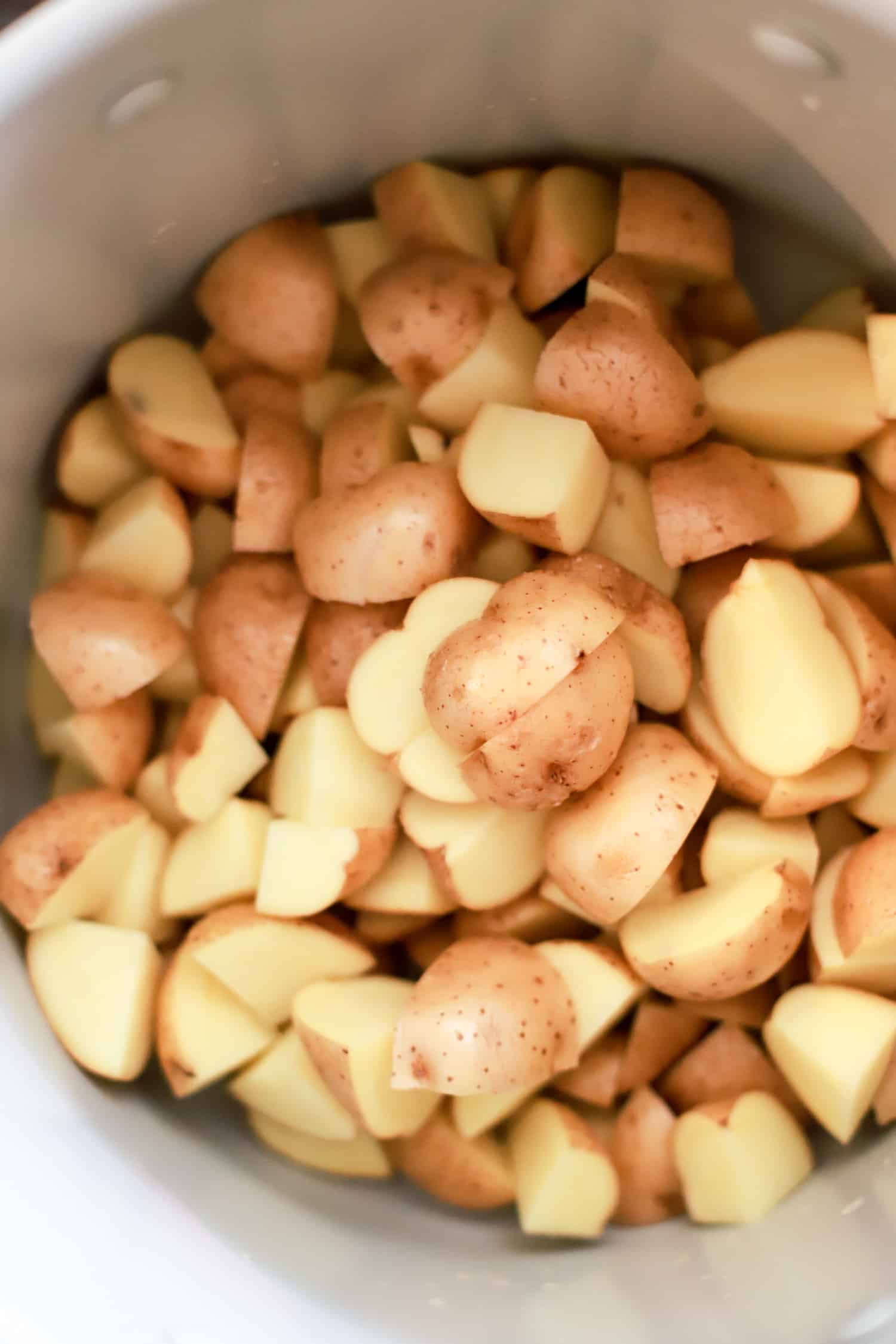 raw cut potatoes in a pot