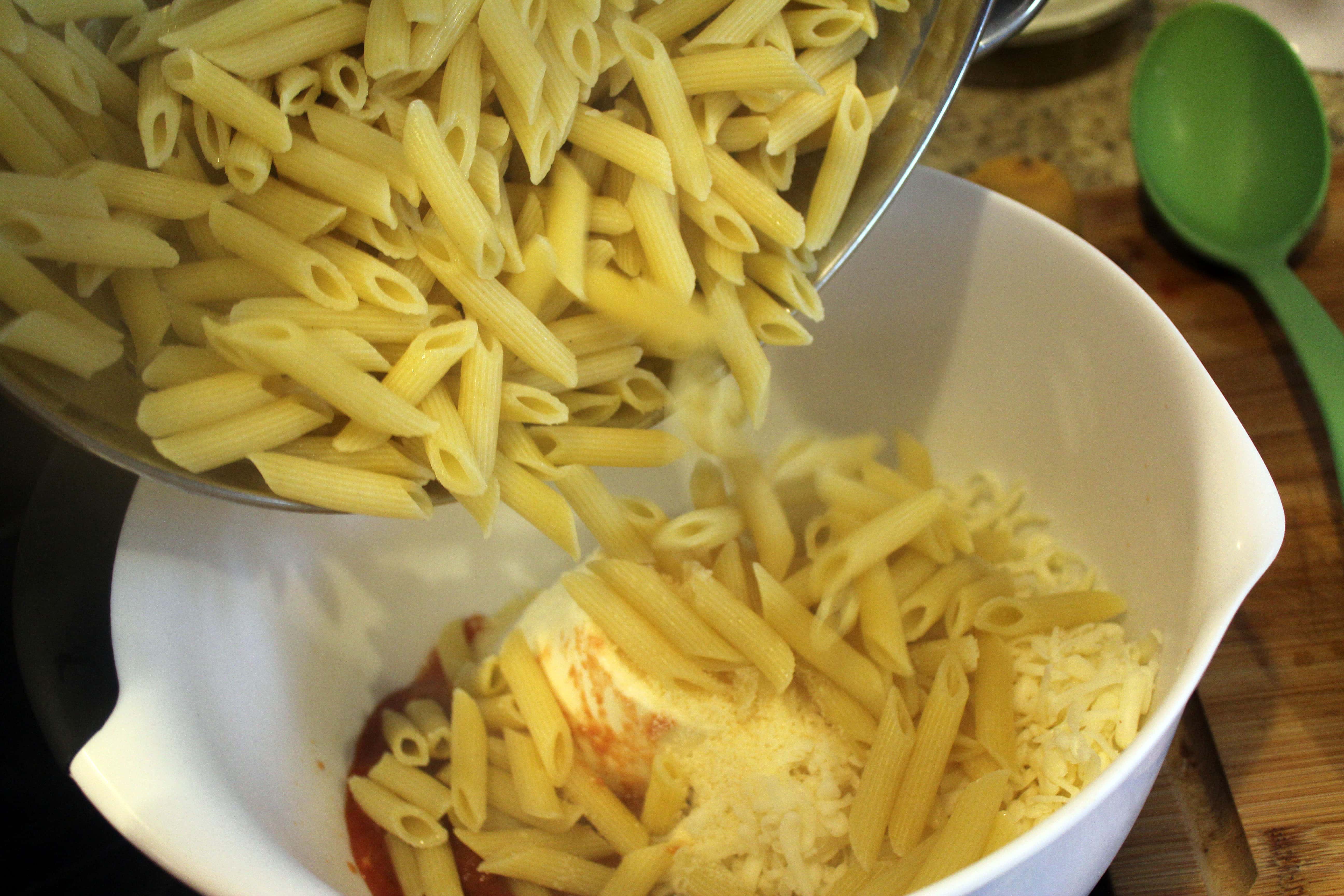 Add pasta to sauce and cheese