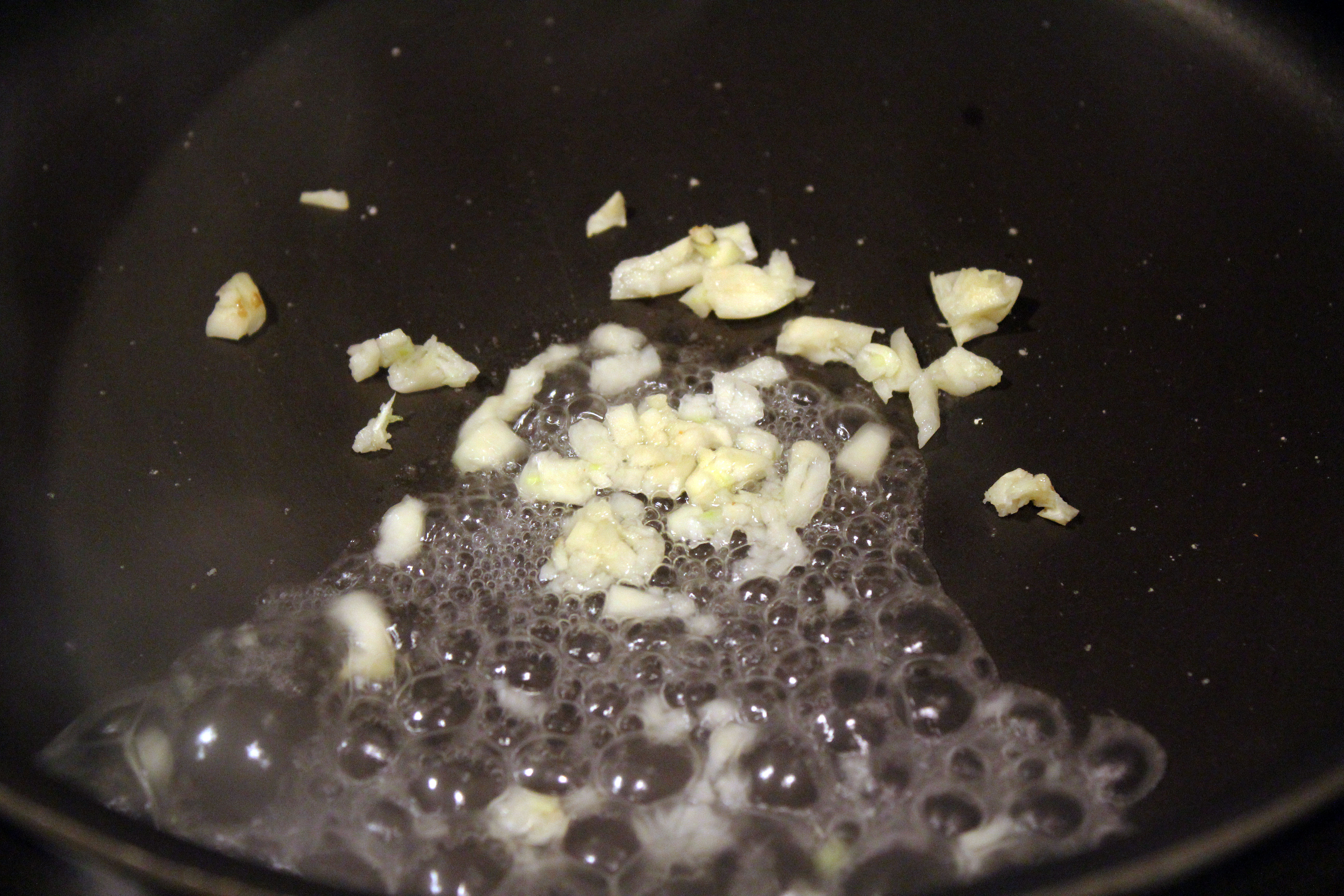 Cook garlic in water