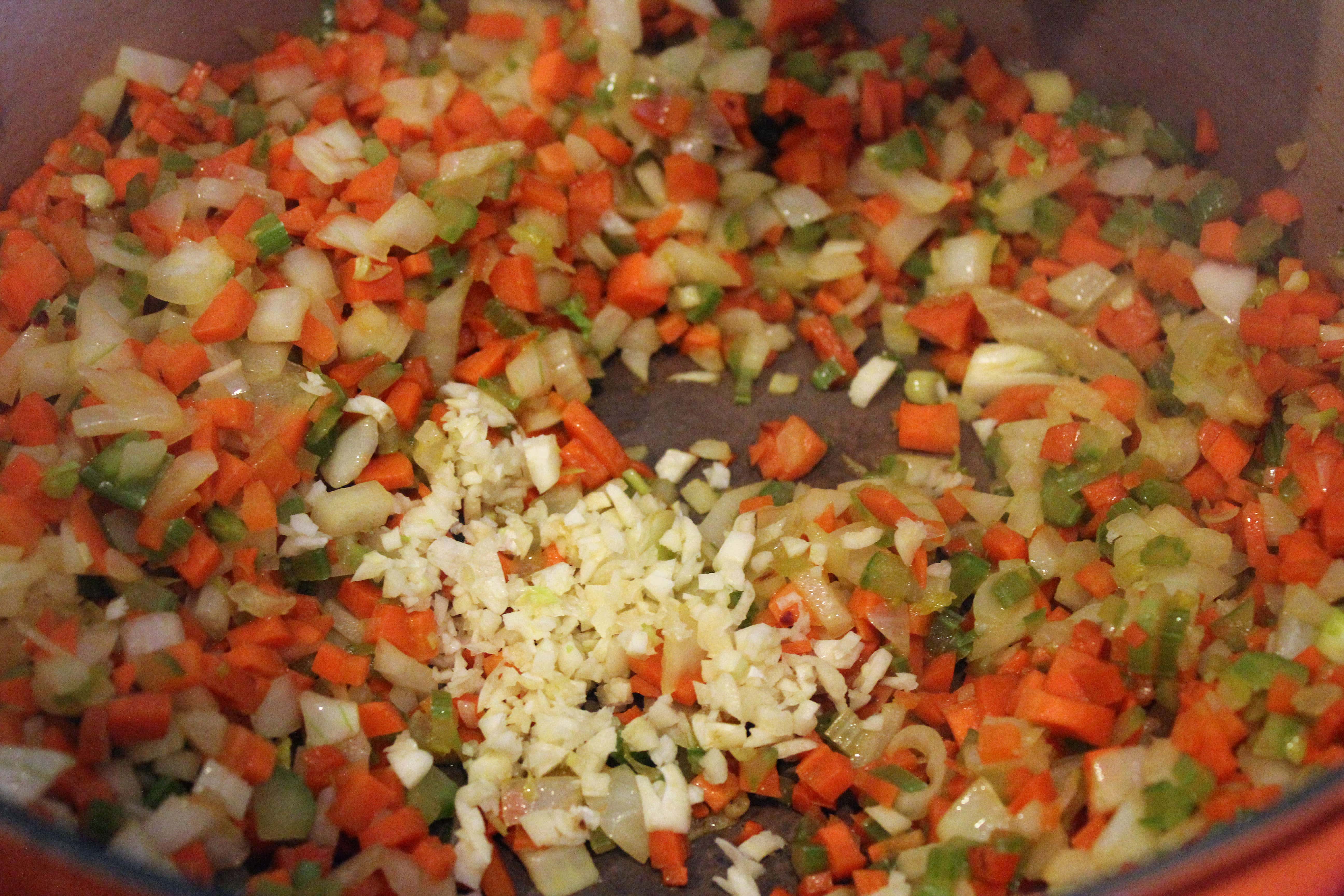 Add garlic to softened veggies