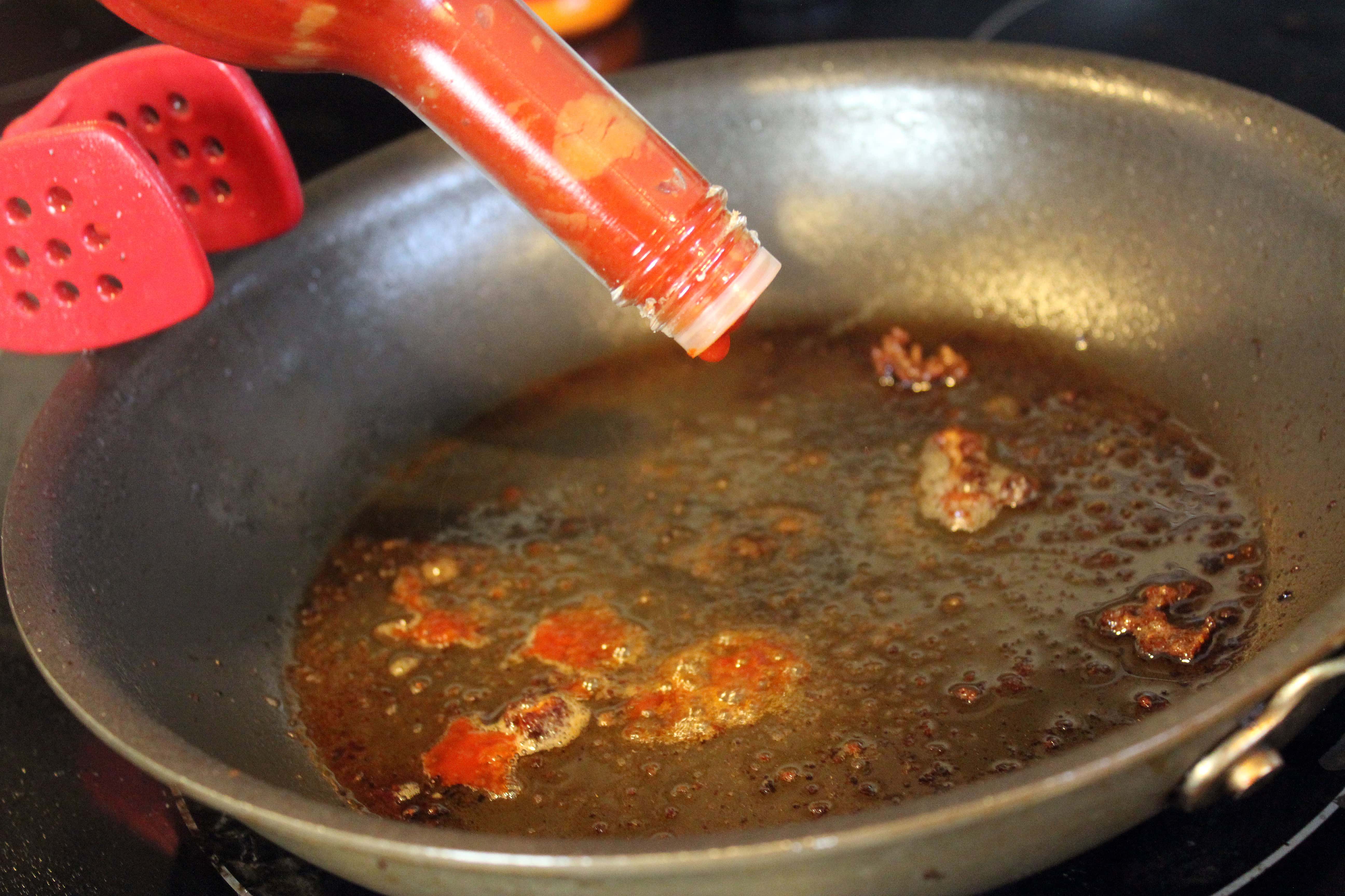Add hot sauce to pan drippings