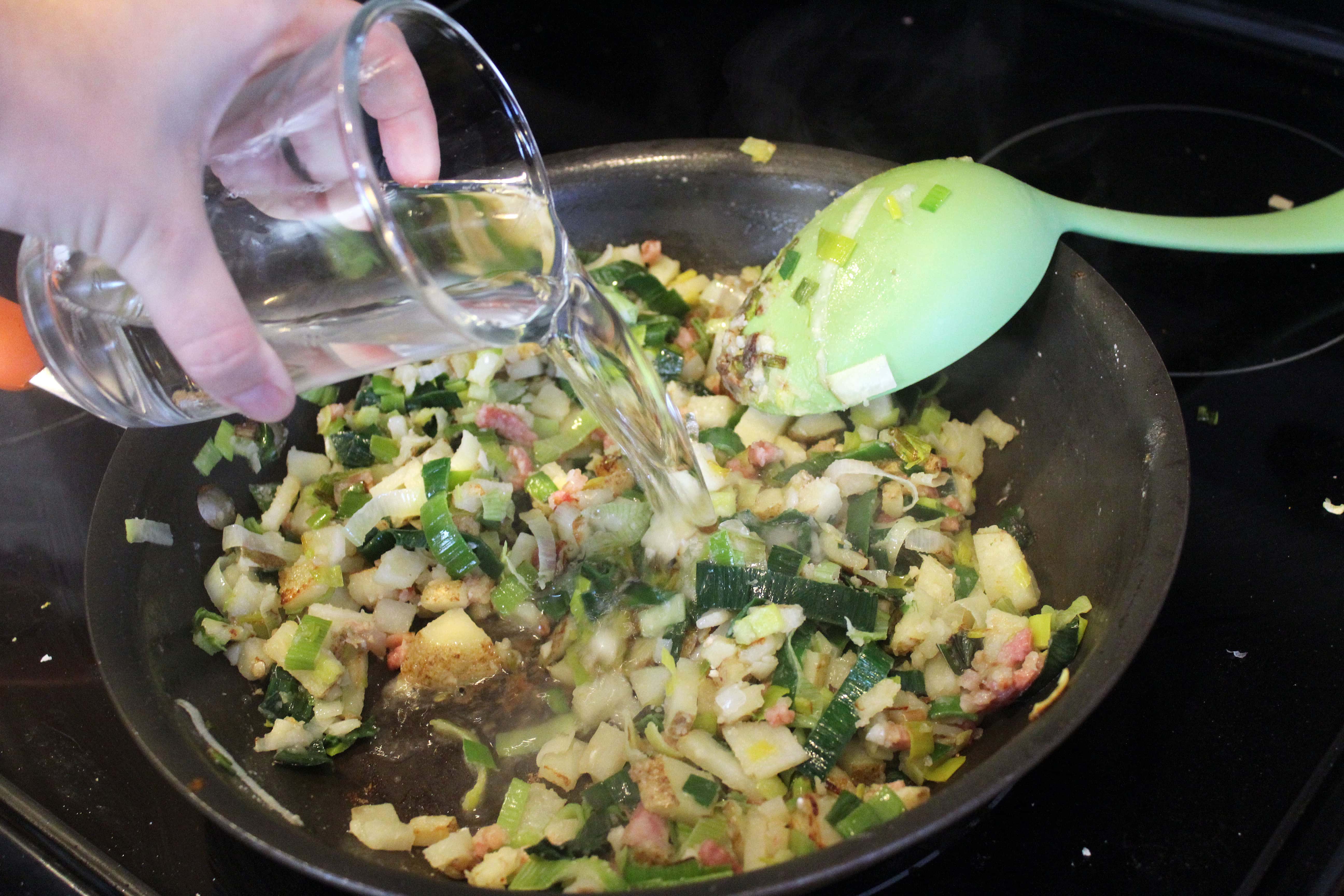 Add wine to garlic and veggies