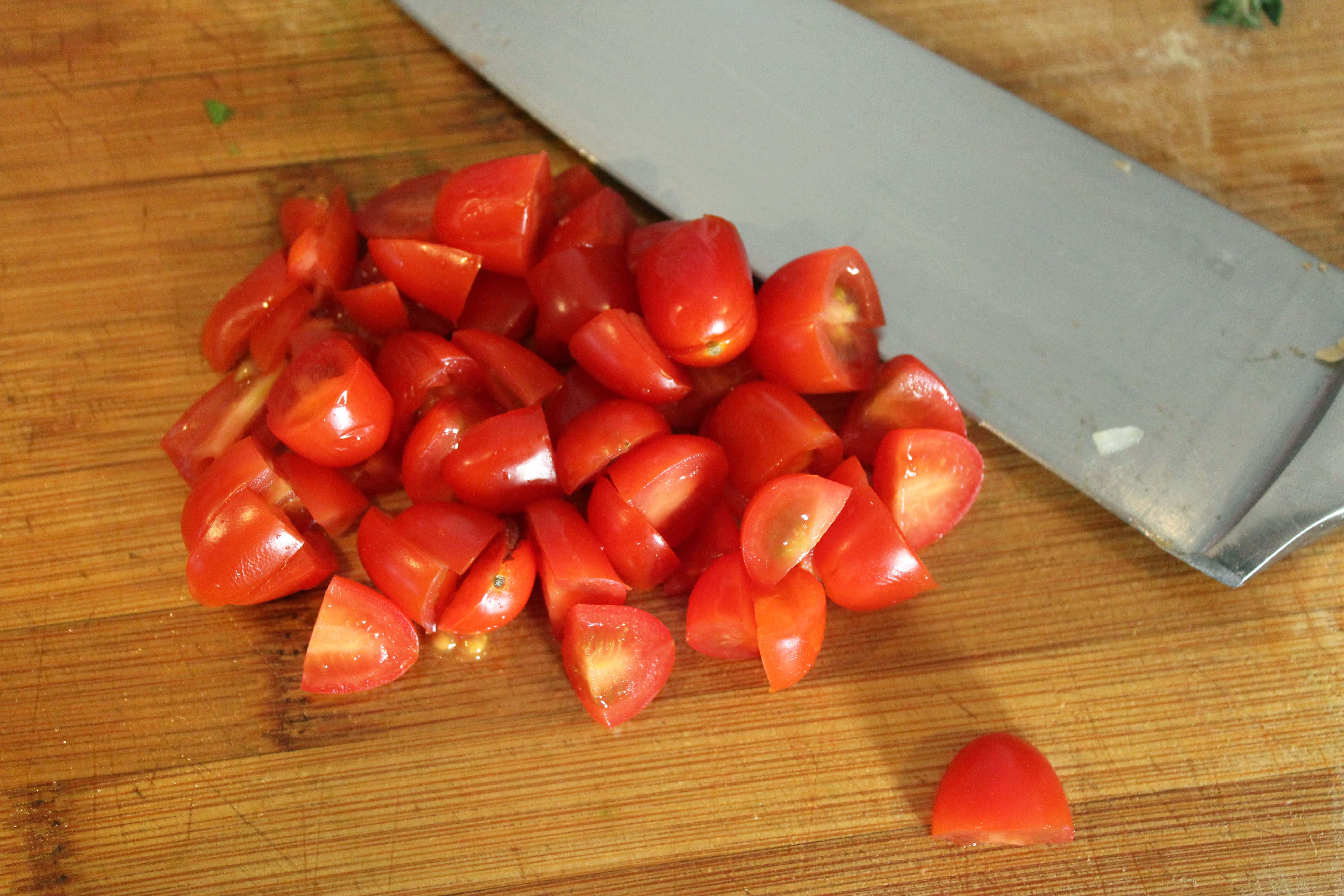 Chop tomatoes for topping