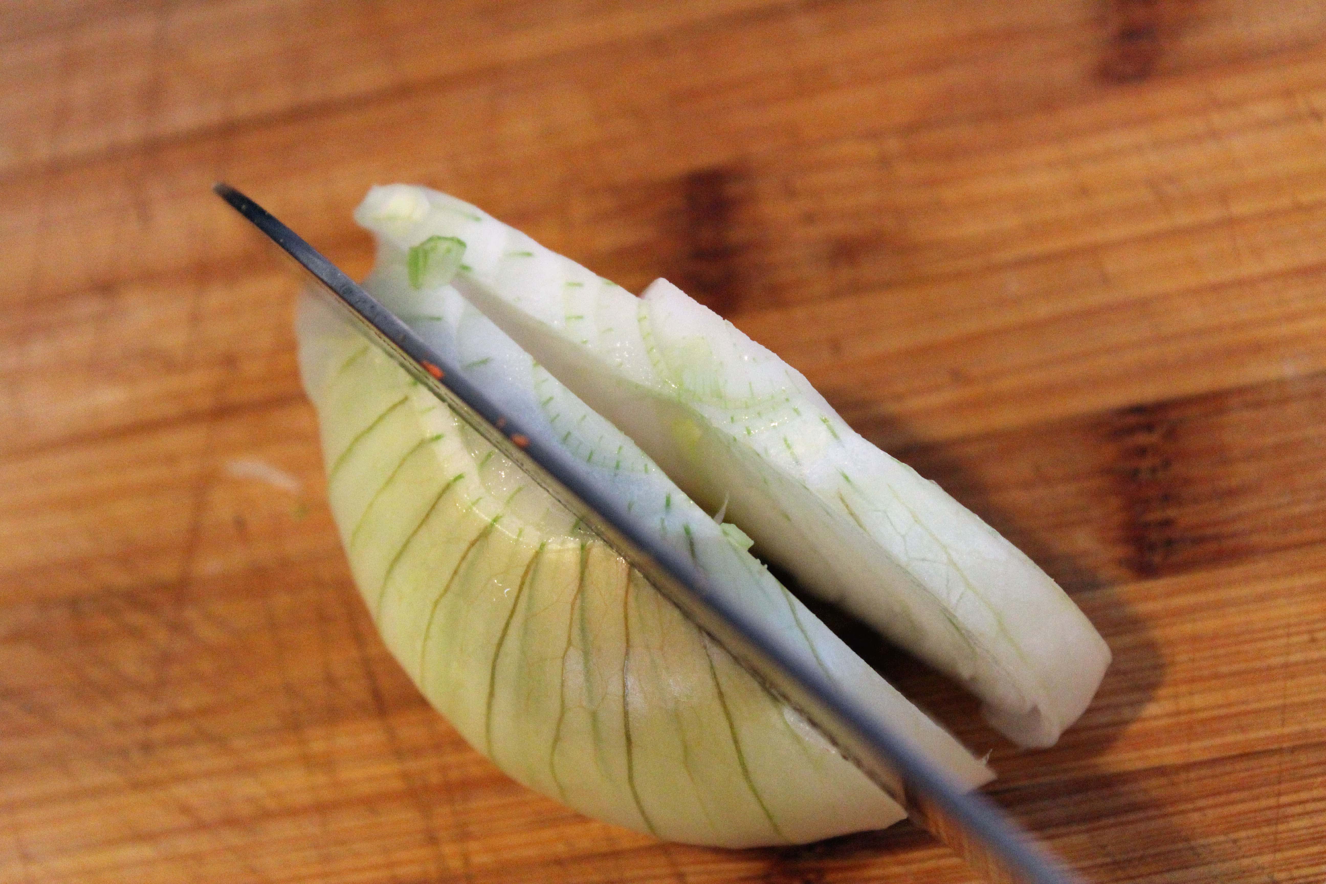 Cut onion half into planks