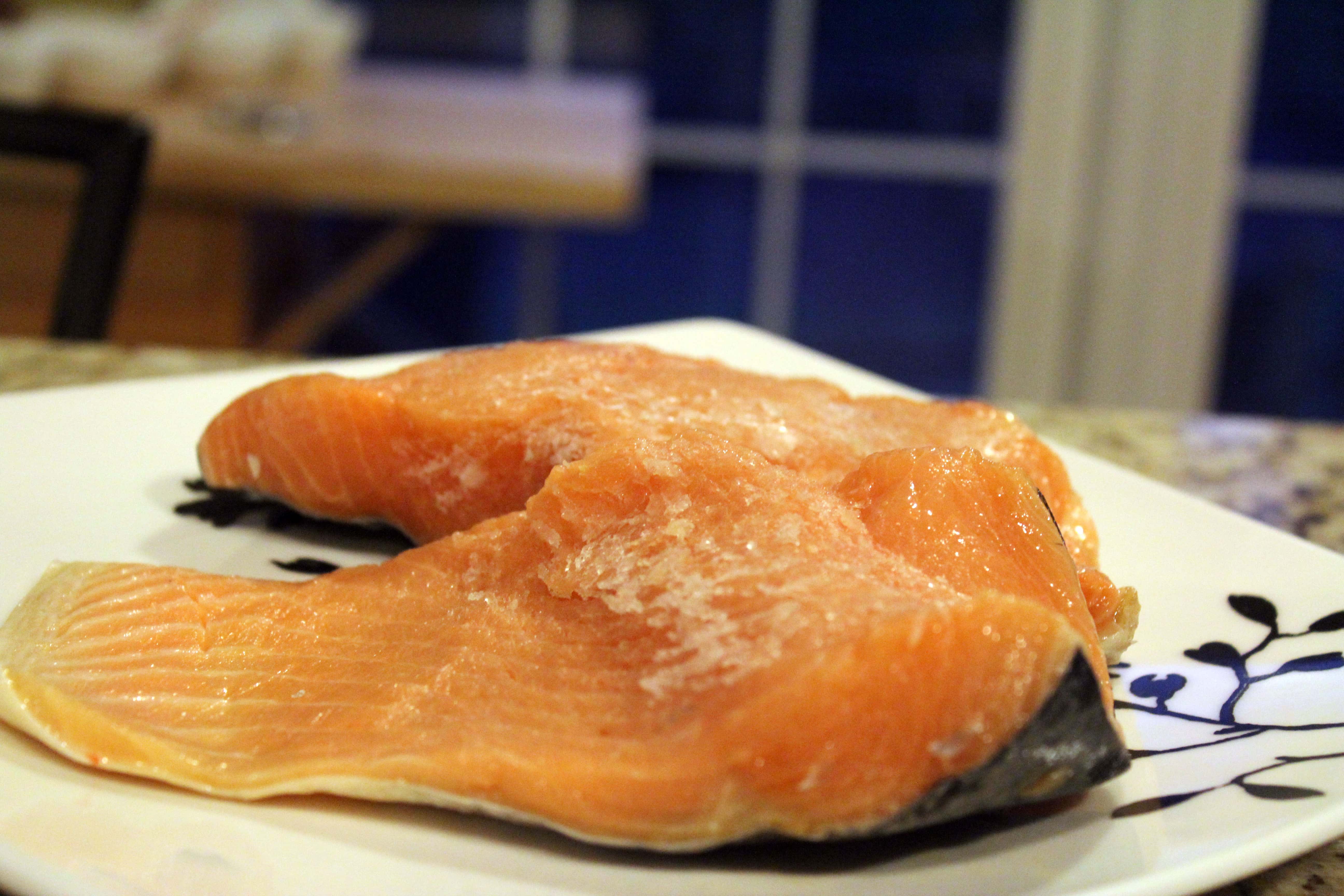 Let salmon filets thaw
