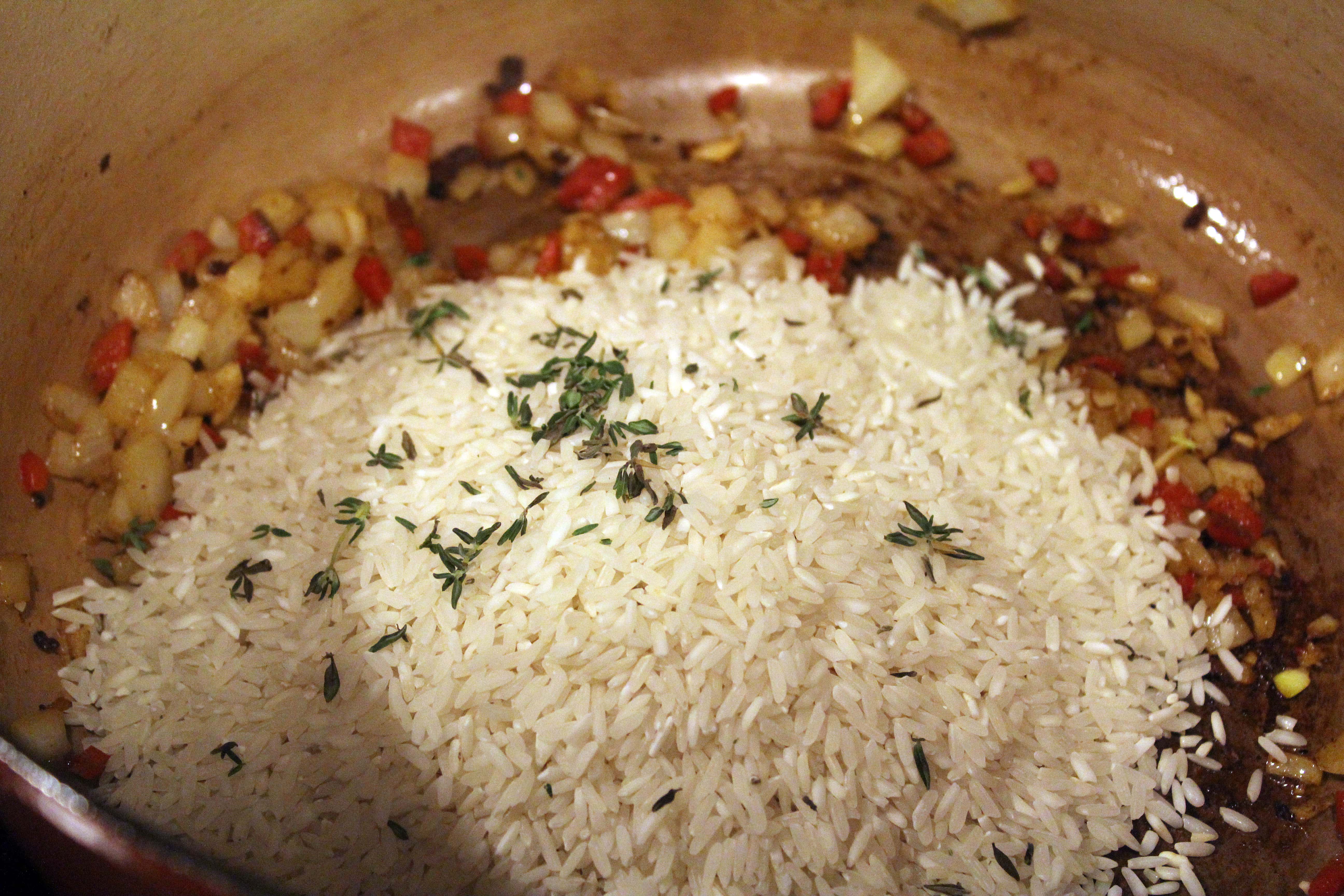 Stir rice and thyme into oil