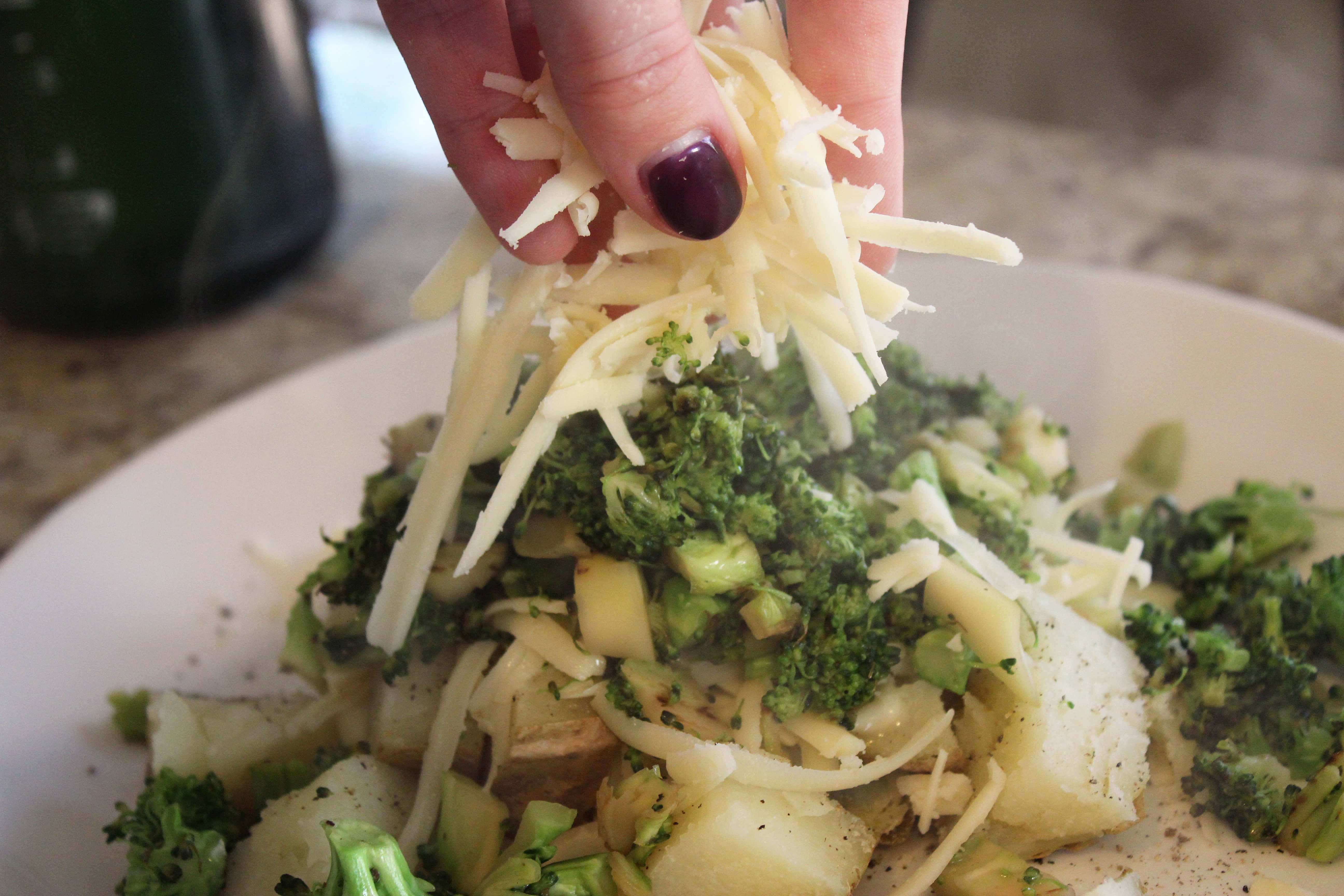 Top warm broccoli with second layer of cheese