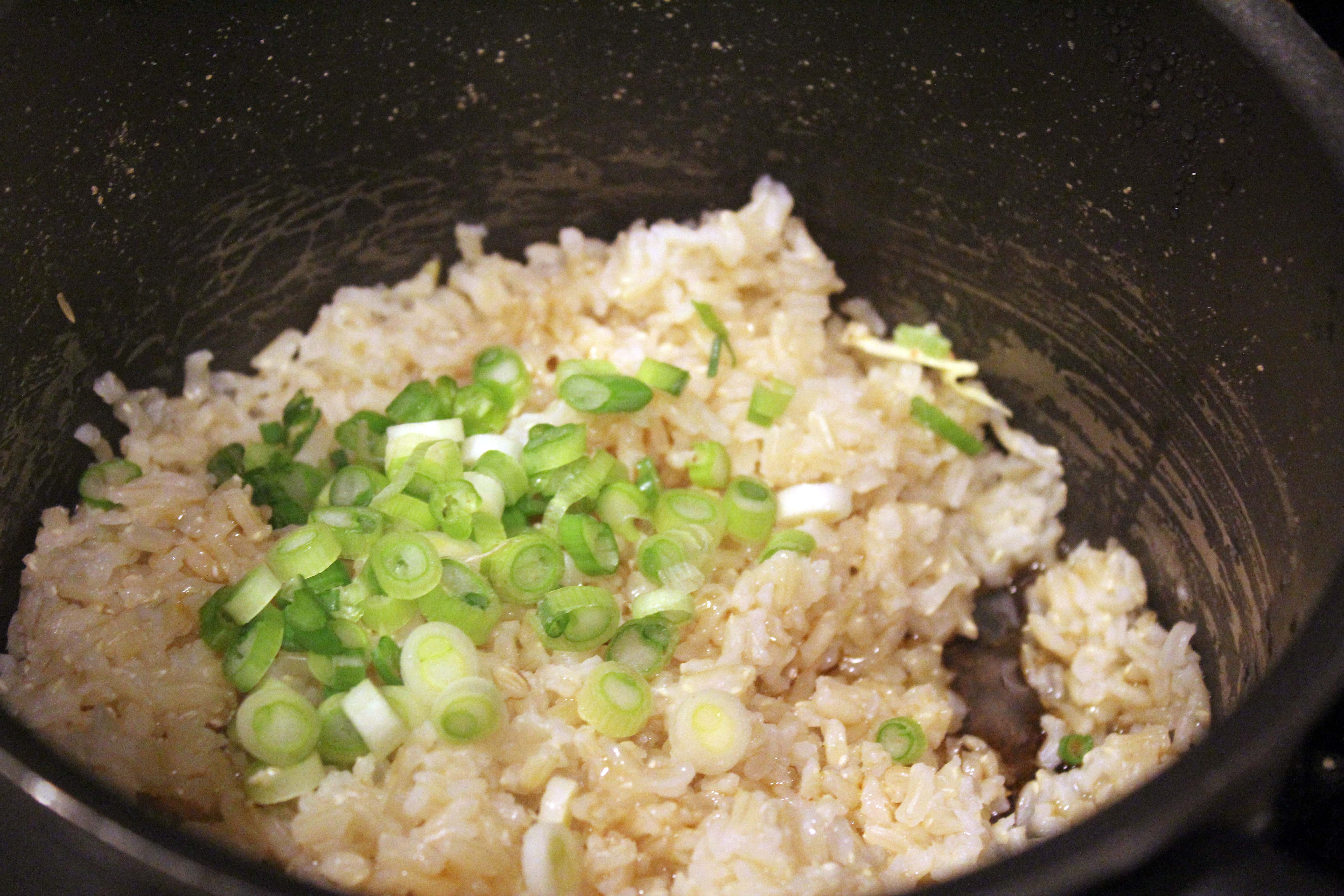 Add scallions to cooked rice