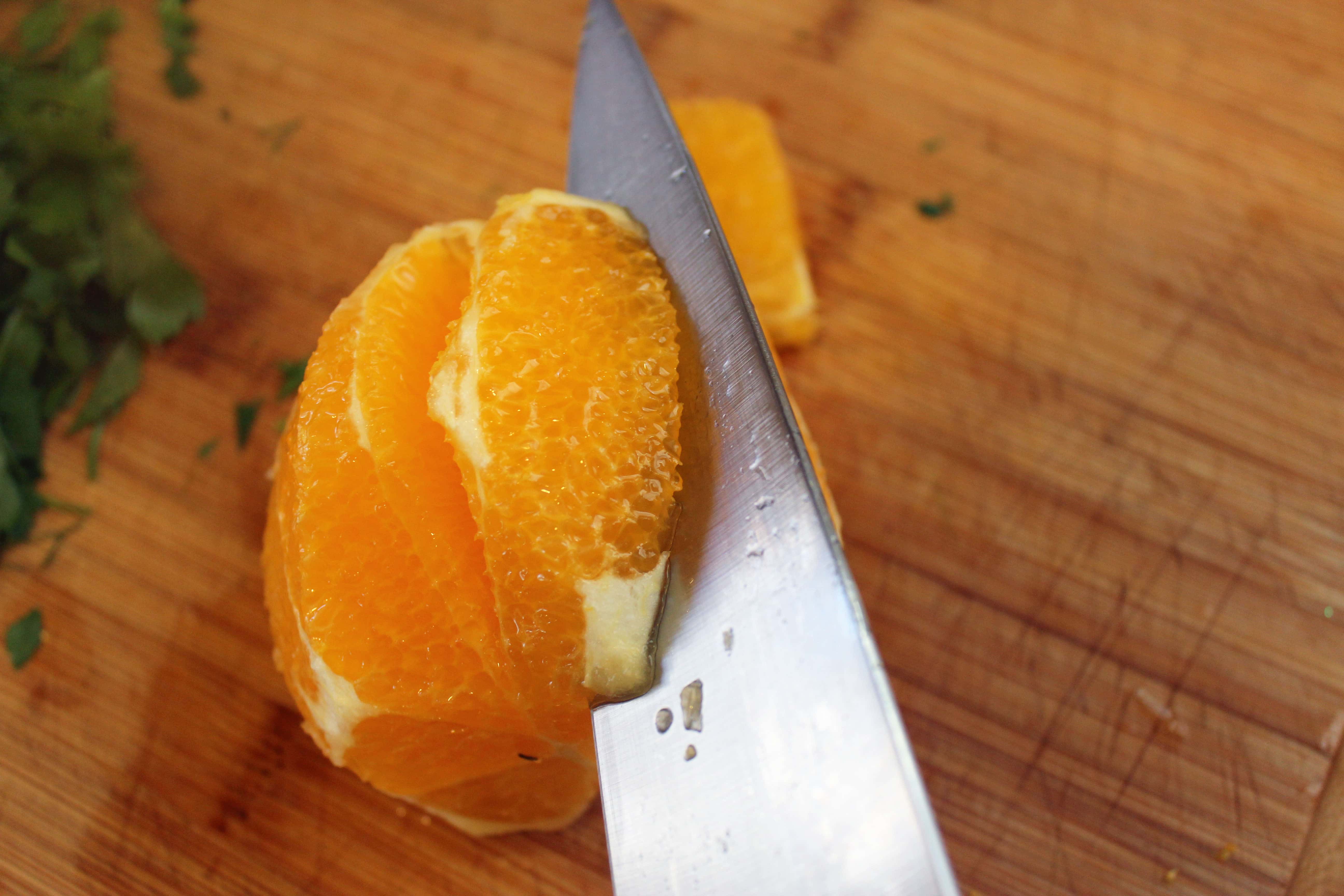 Cut into sides of orange segment
