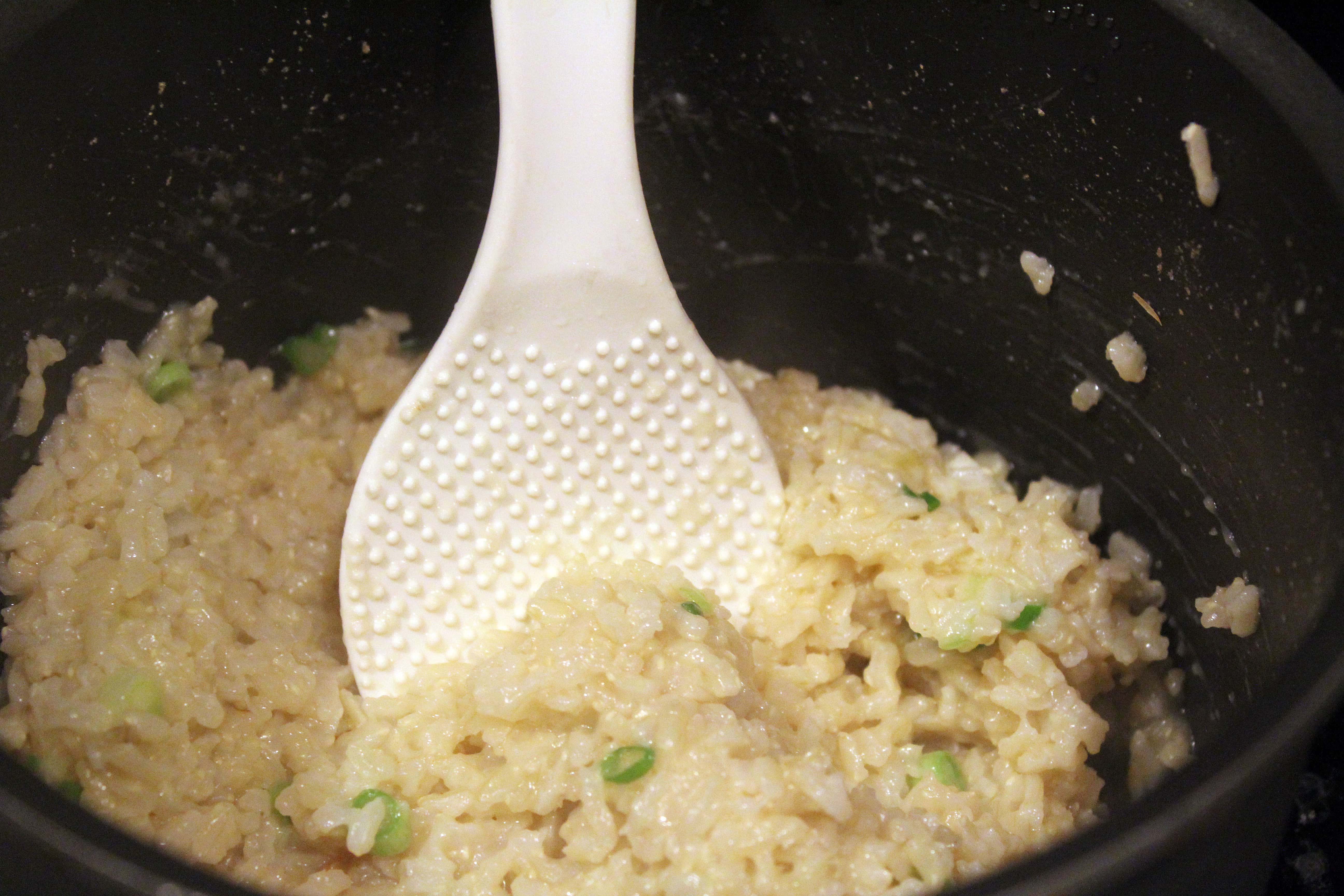 Stir scallions and seasoning into rice