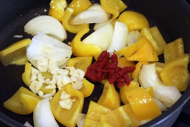 Add garlic and tomato paste to veggies