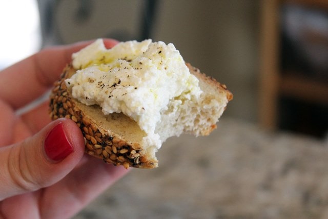 Bite of toast with ricotta
