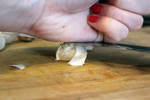 Crush garlic with knife