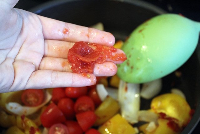 Gently crush tomatoes with your hand