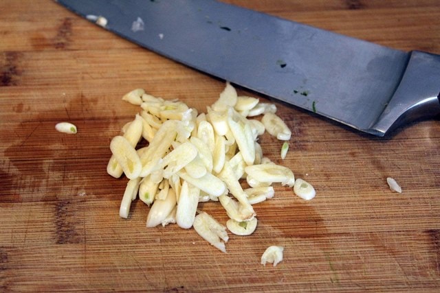 Thinly slice garlic
