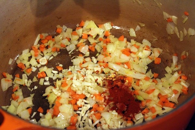 Add garlic and spices to softened veggies