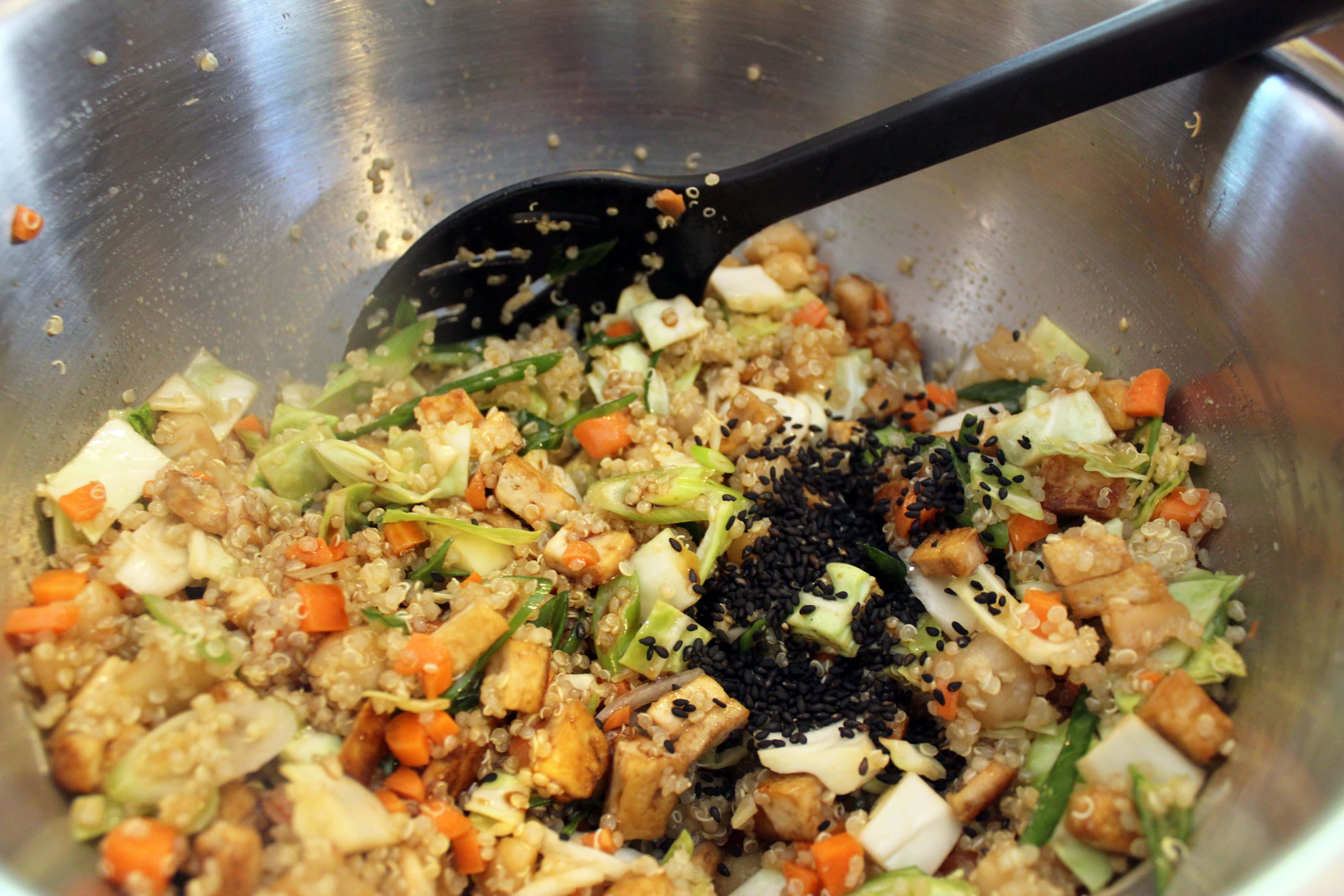Add sesame seeds to salad and then taste