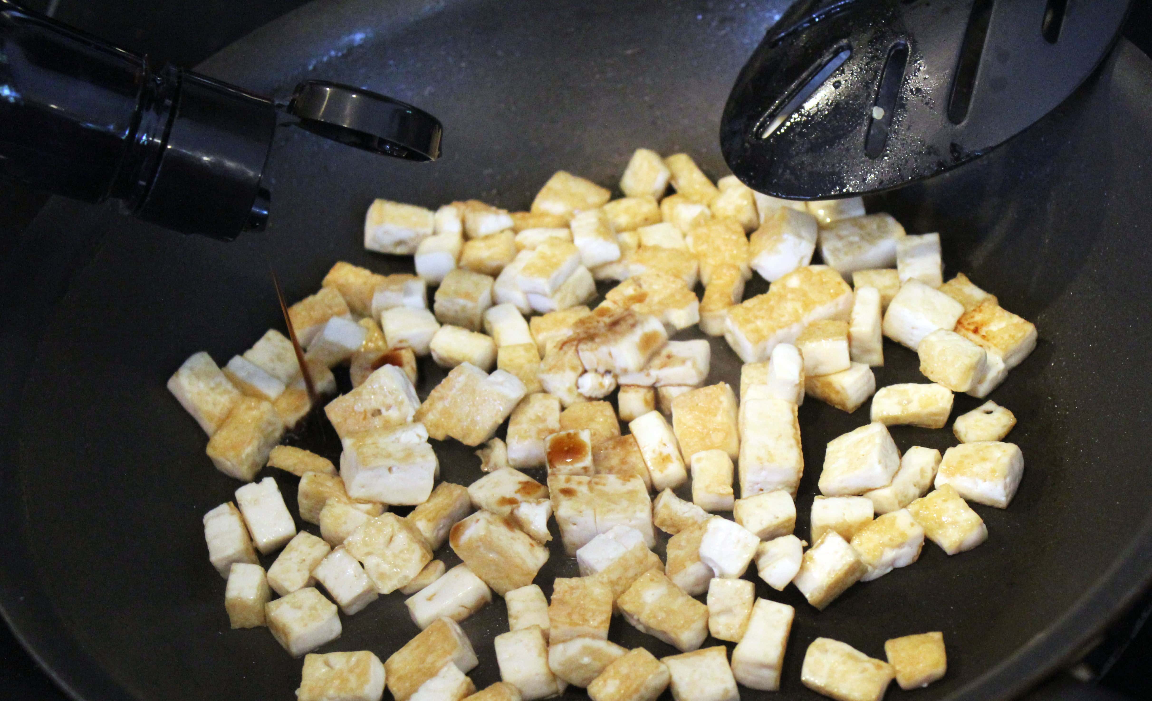 Drip soy sauce on tofu after griling