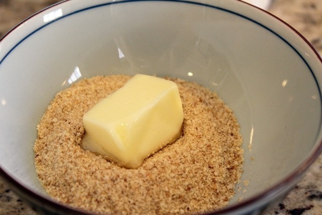 Softened butter and crumbs