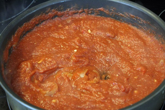 Stir tomatoes into spices