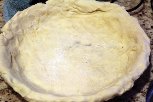 Stretch crust into pie plate