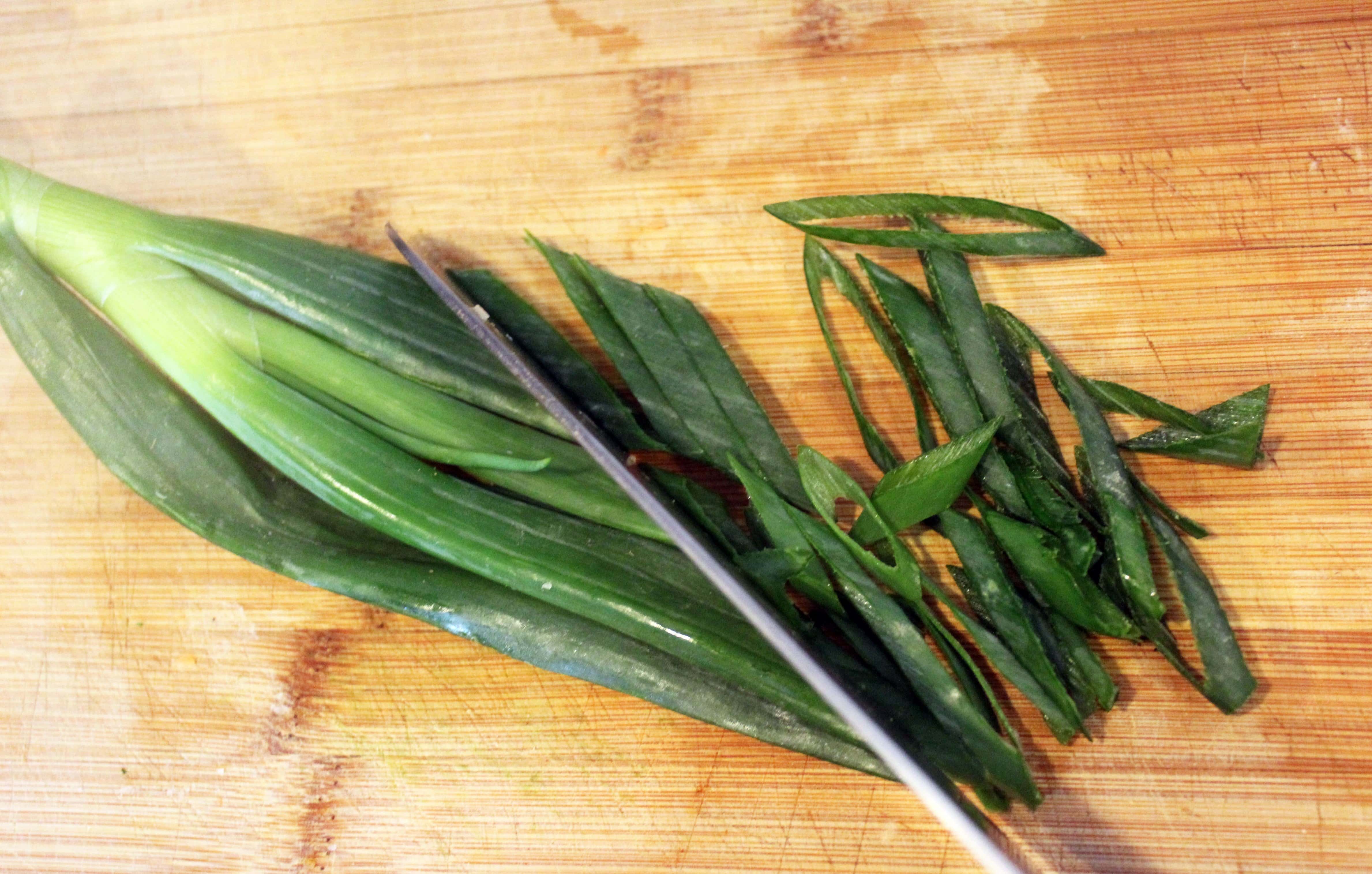 Thinly slice scallions on an angle