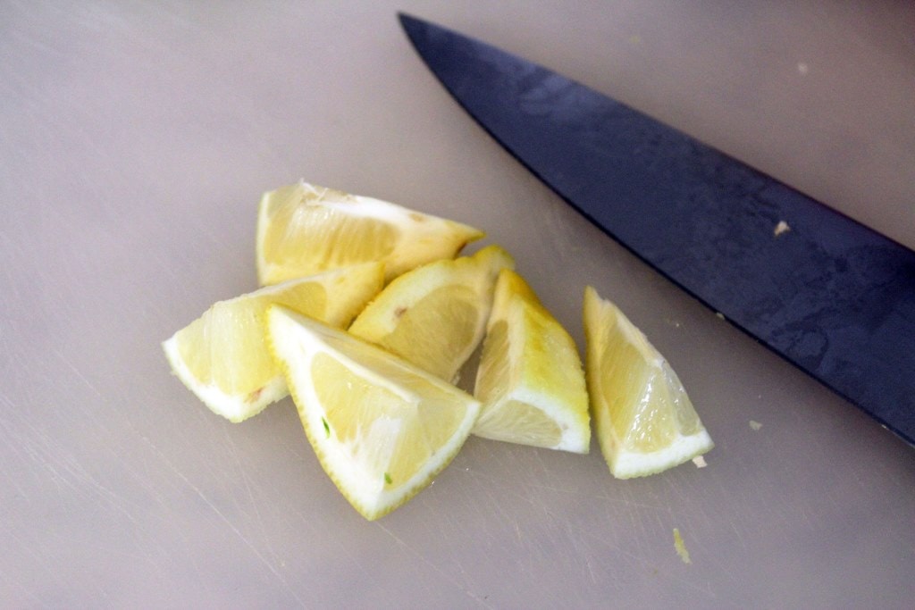 Cut lemon into wedges