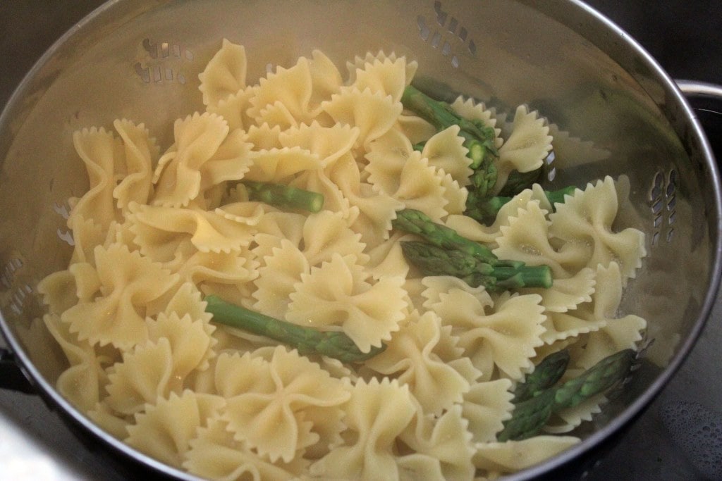 Drain pasta and asparagus tops