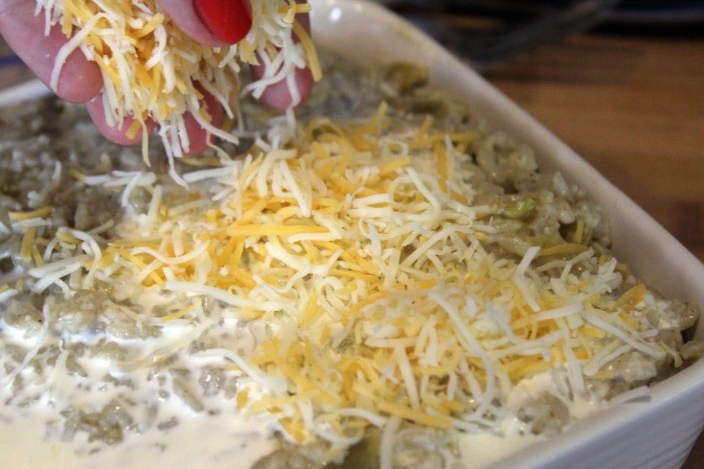 Top rice with extra cheese before baking