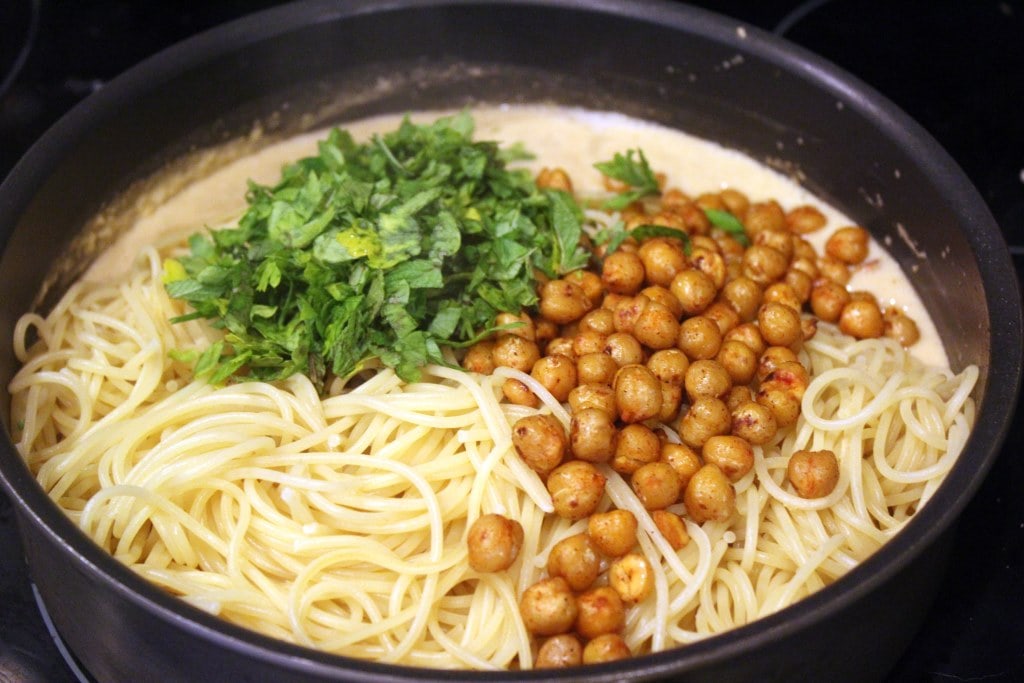 Toss chickpeas with herbs and sauce