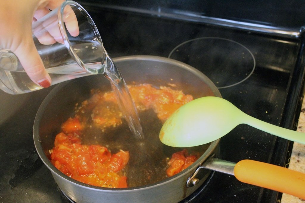 Add wine to softened tomatoes