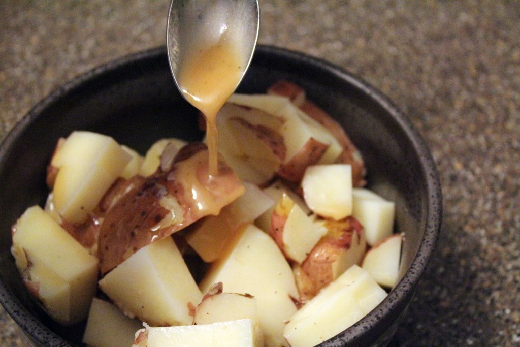 Drizzle dressing over potatoes