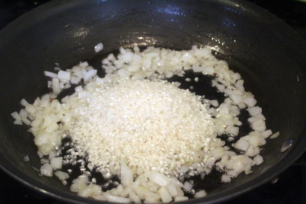 Add rice to onion