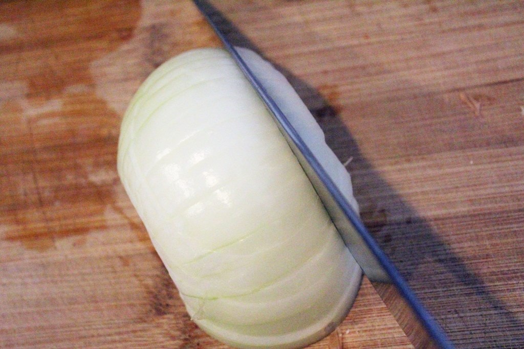 Cut onion into strips