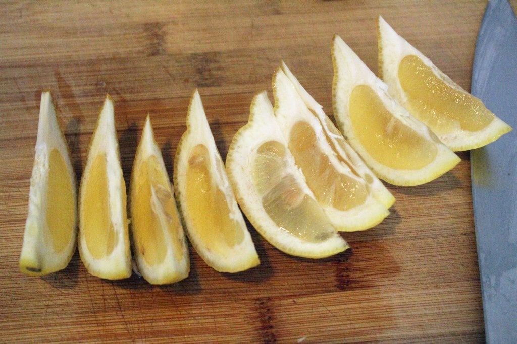 Cut second lemon into wedges