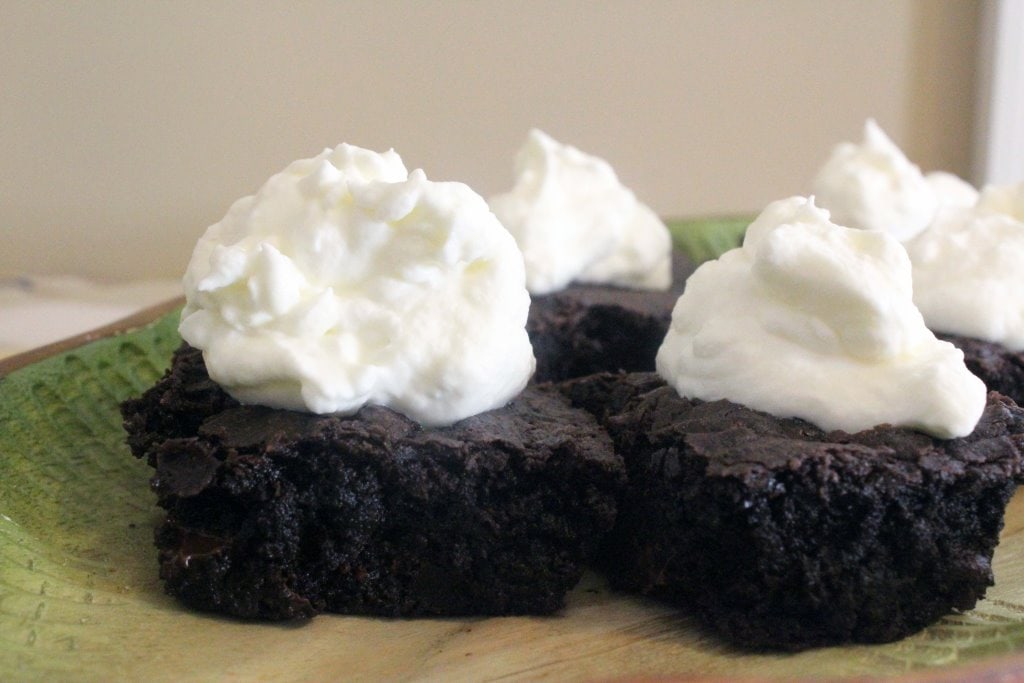 Brownie topped with cream