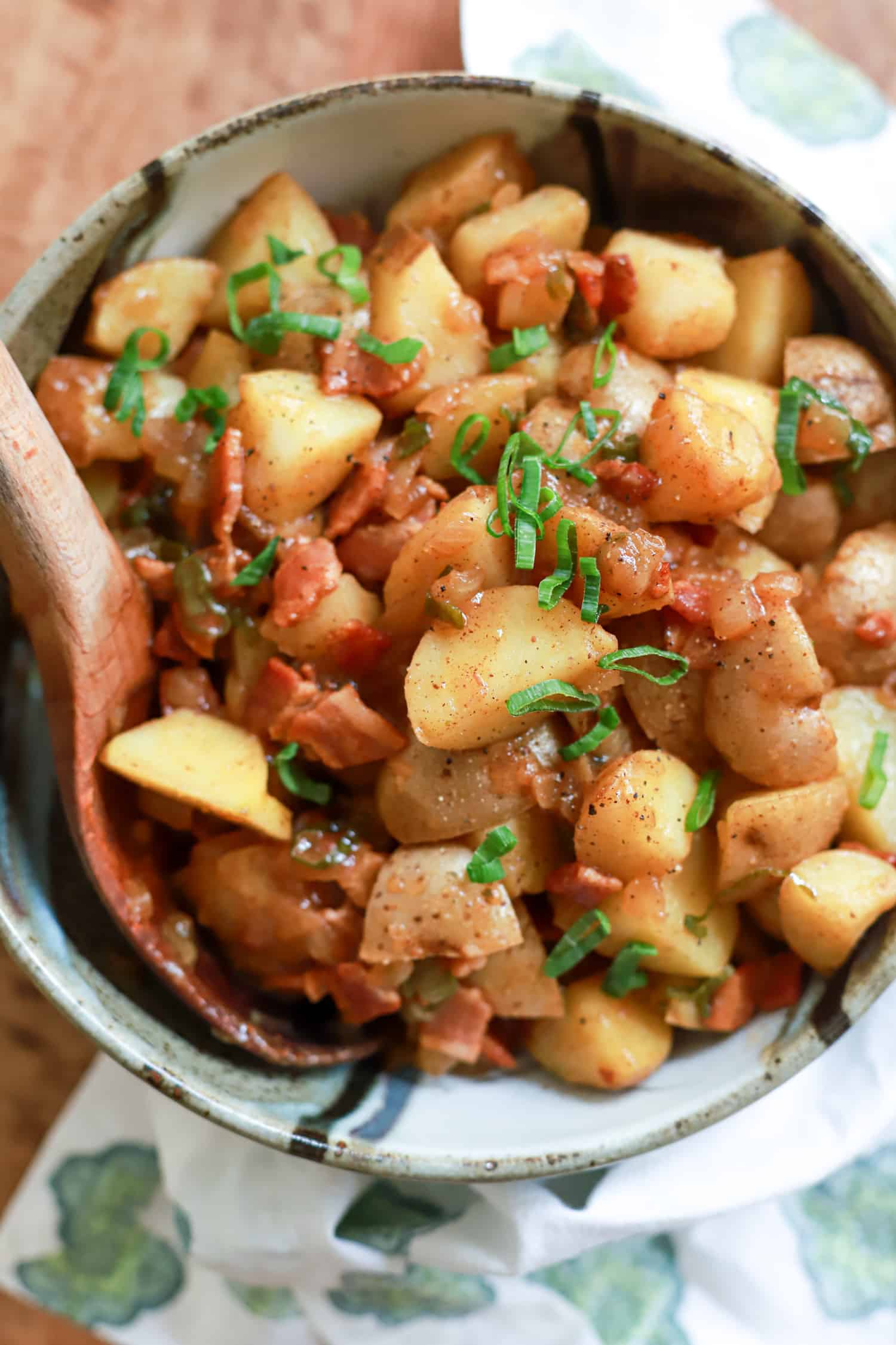 Top view of large bowl of german potato salad with bacon dressing.