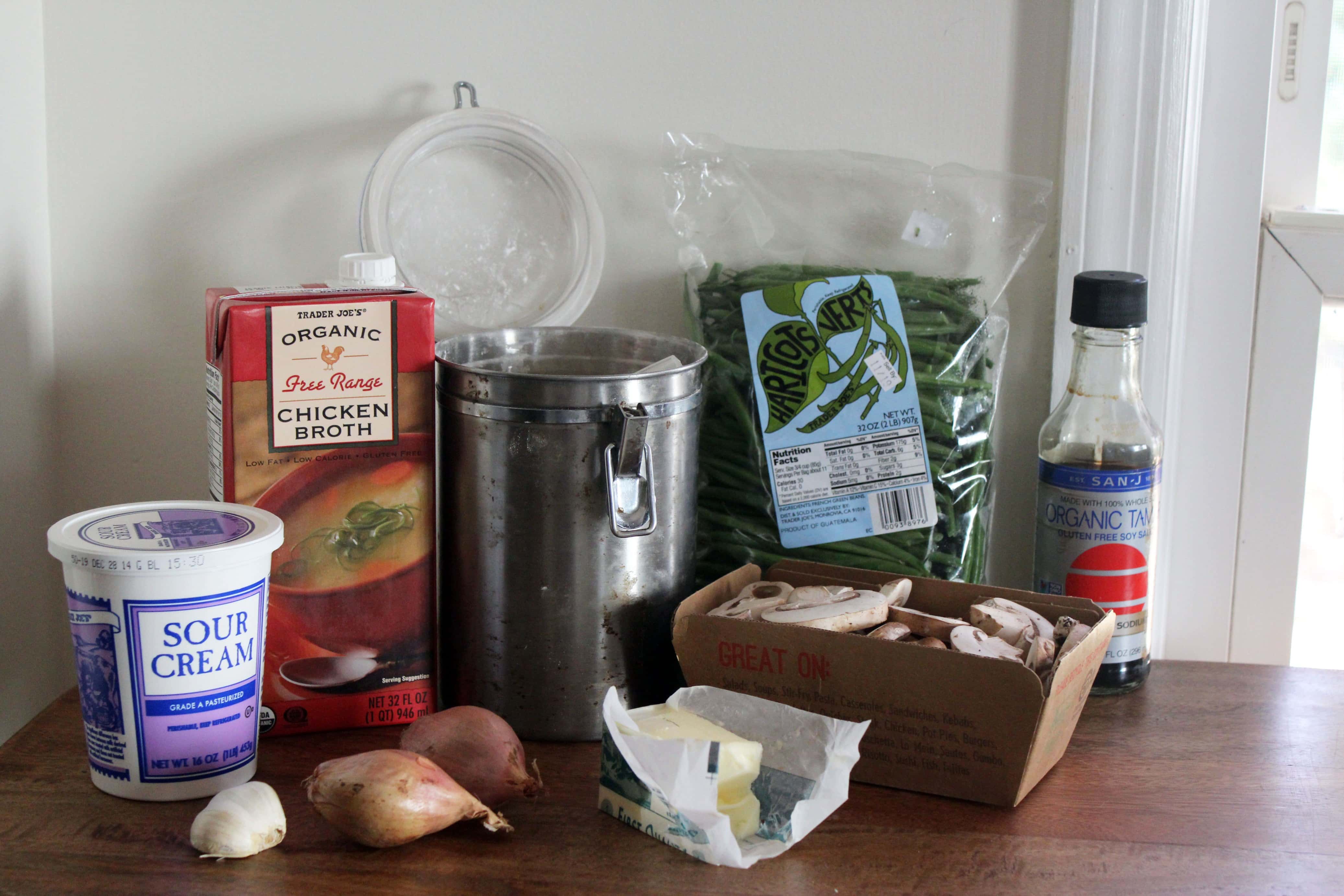 ingredients for healthy green bean casserole on a wooden board.