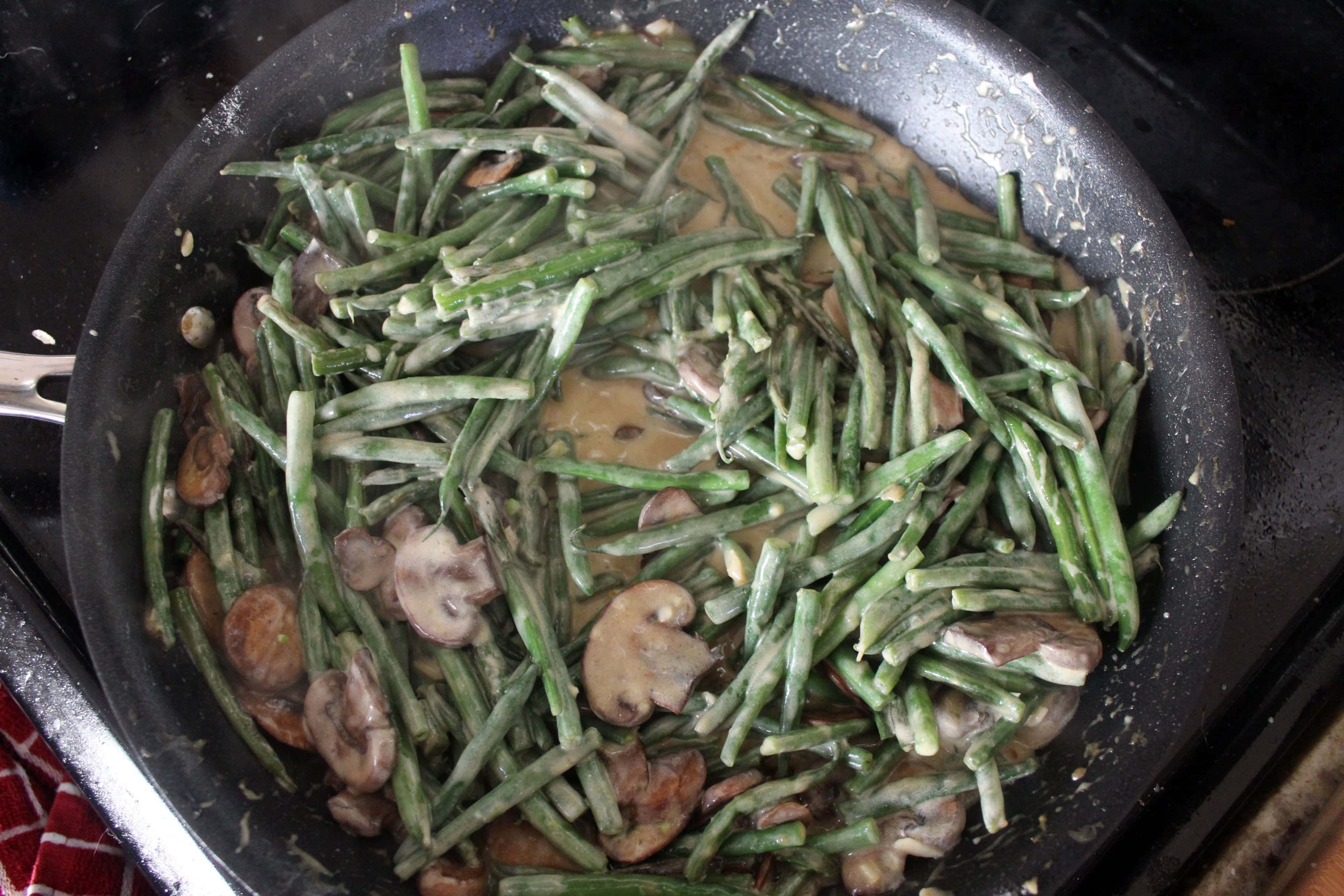 skillet with filling for green bean casserole without mushroom soup.