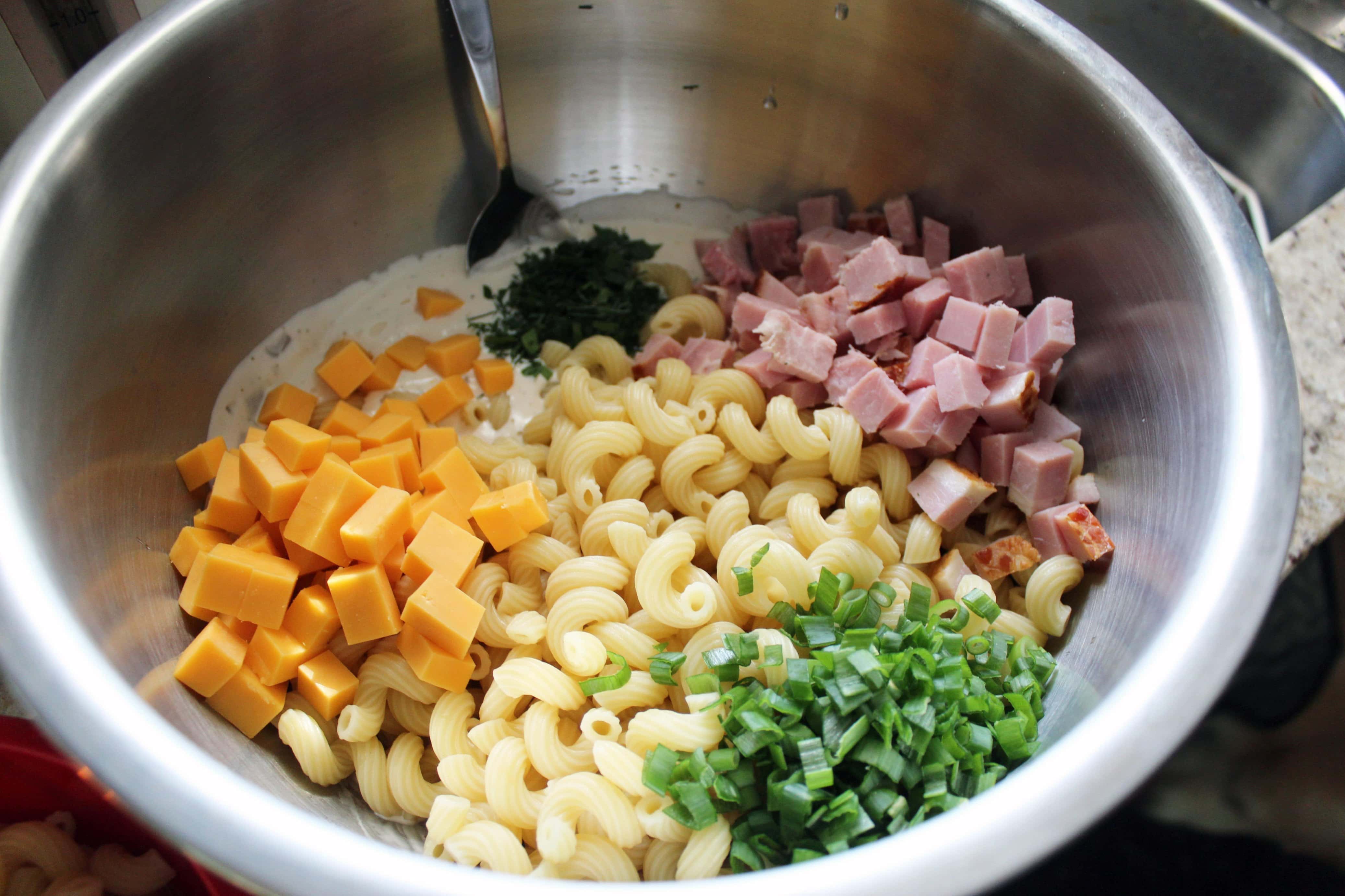 ingredients for southern macaroni salad in a bowl not stirred up