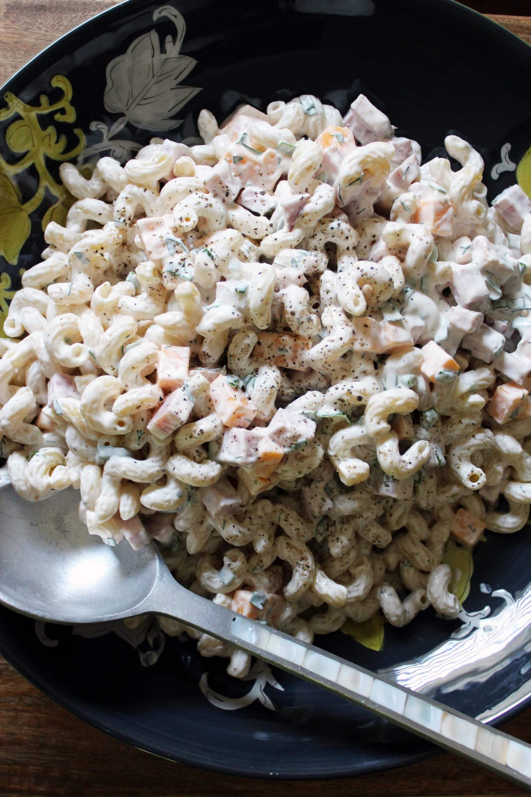 close up bowl of creamy macaroni salad southern style