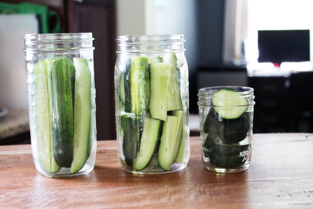 jars full of cucumber spears and slices