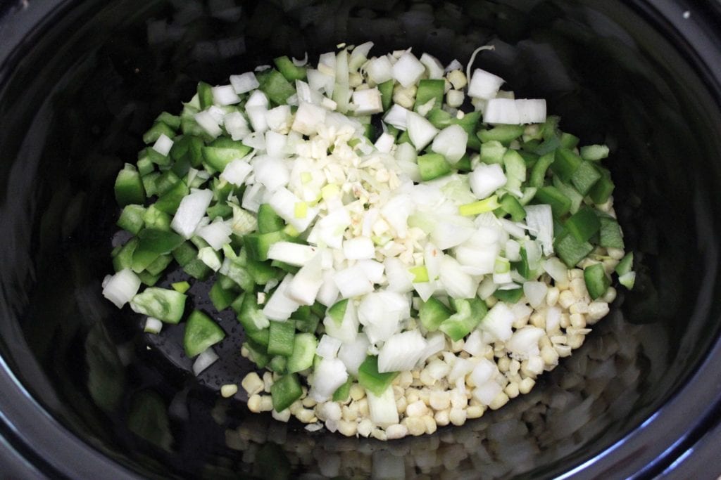 chopped veggies in slow cooker