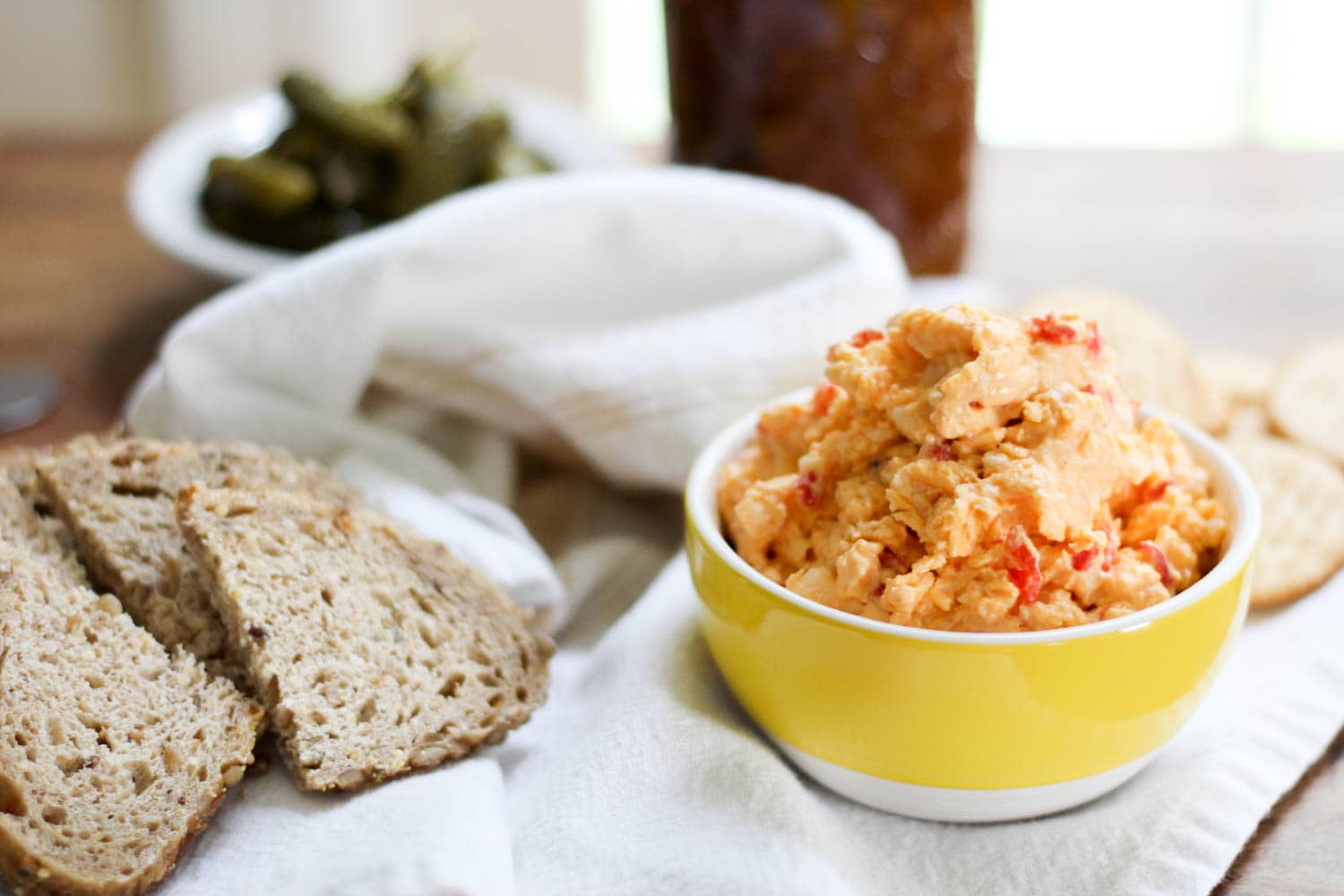 bread and old fashioned pimento cheese in yellow bowl.